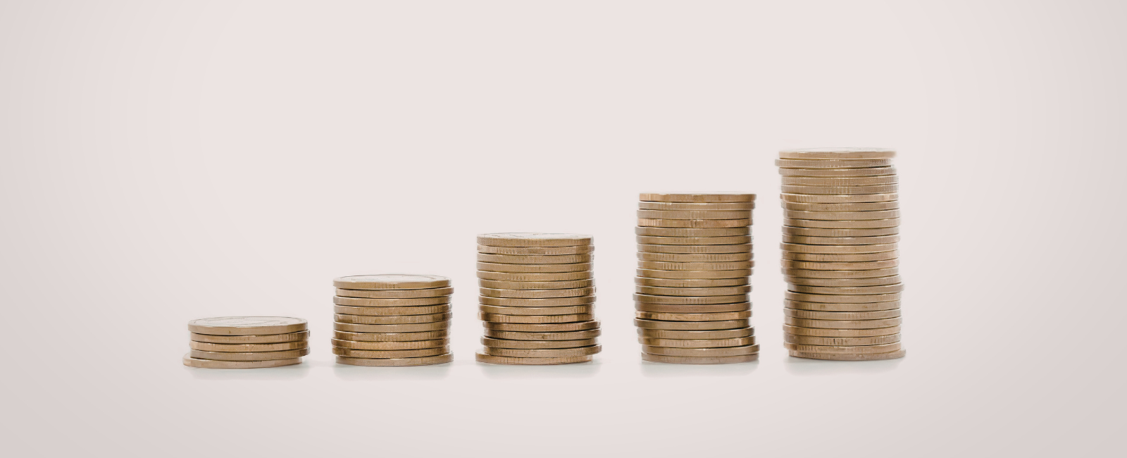 Five columns of coins piling up incrementally